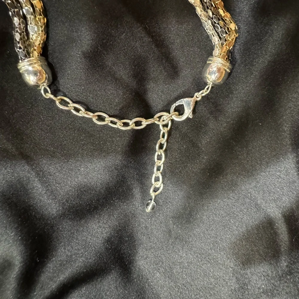Necklace 3 Strand looks like Gold Silver Platinum. 16 to 20 in adjustabl…